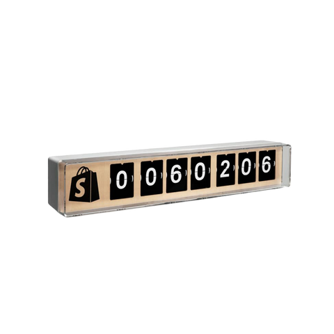 A slightly side angled view of a 7 digit Shopify Counter with a black Shopify logo. 