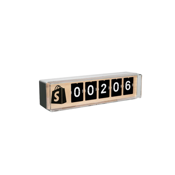 A slightly side angled view of a 5 digit Shopify Counter with a black Shopify logo.